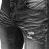 Jeans herr med nötningar och slitningar in zoomad