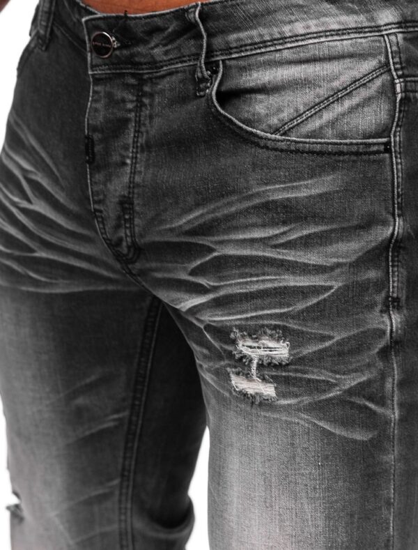 Jeans herr med nötningar och slitningar in zoomad