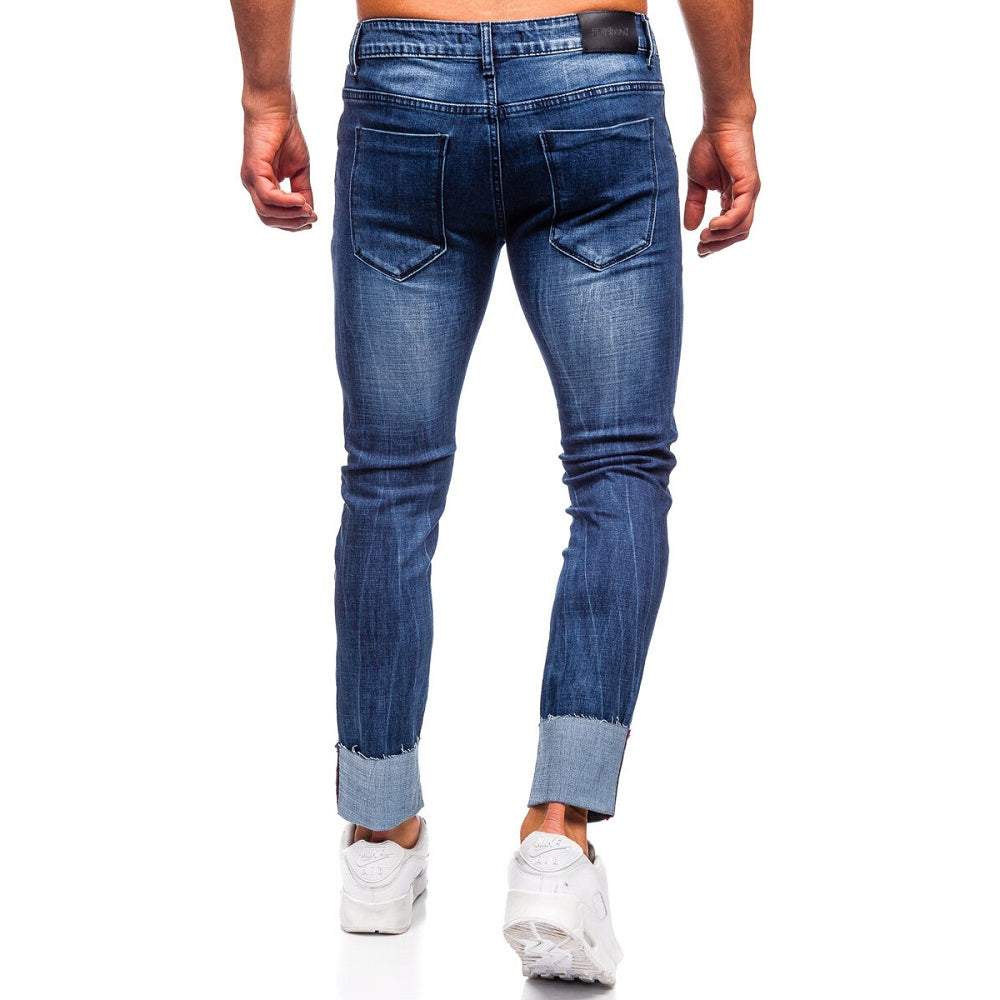 Mörkblå slim fit jeans - Snygga slitningar herr bakifrån