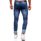 Mörkblå slim fit jeans - Snygga slitningar herr bakifrån