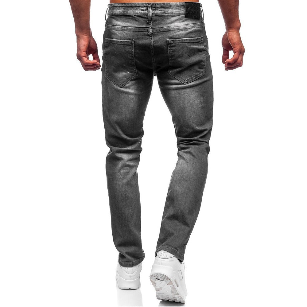 Jeans med målarstänk - Slitna herrjeans bakifrån