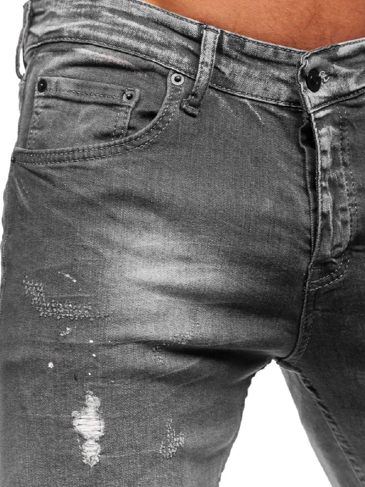 Jeans med målarstänk - Slitna herrjeans bakifrån
