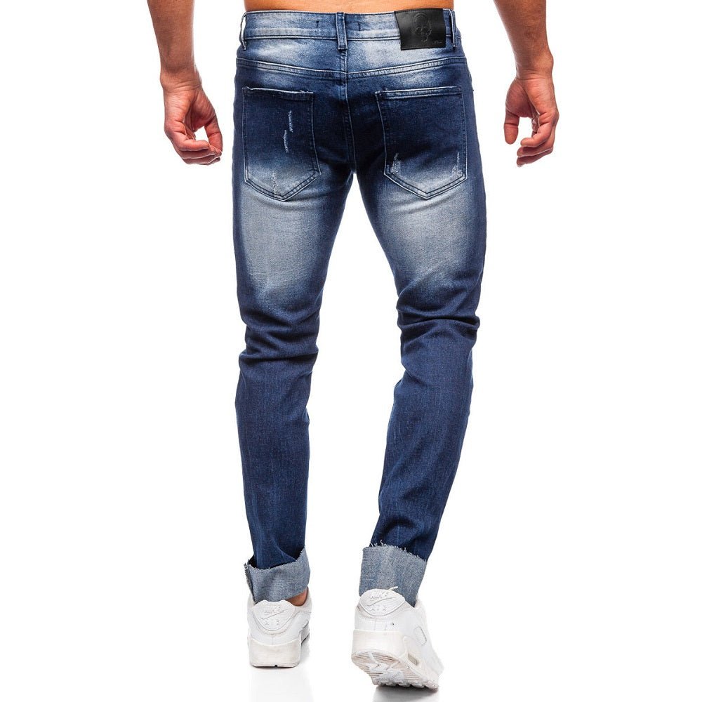 Blå slitna jeans med lagningslappar - Herr bakifrån