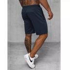 Billiga herrshorts flera färgval mörkblåa bakifrån