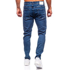 Lätt slitna herrjeans - Mörkblå regular fit bakifrån
