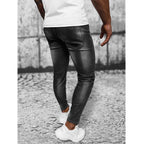 Skuggade jeans - Svarta slim fit herr bakifrån